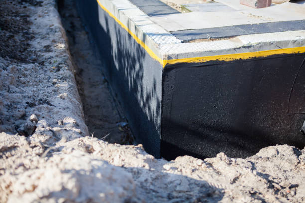 Professional Basement Waterproofing technician working in Mableton, GA
